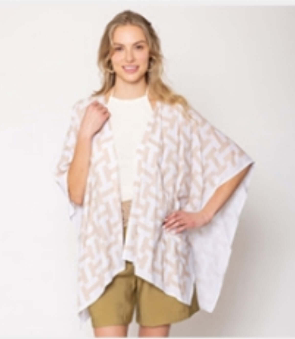 Flat lay of Classic Kimono Lupita on neutral background